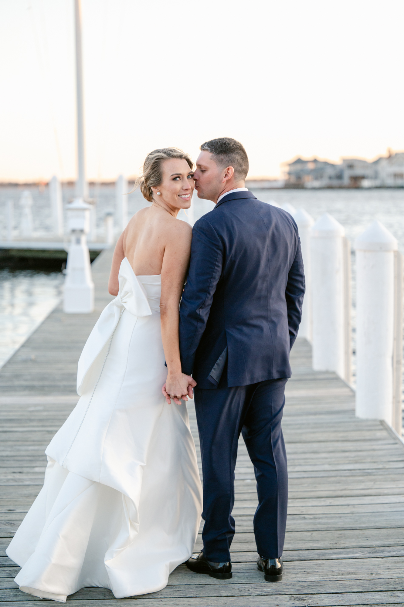 bride-groom-embrace-nautical-wedding-bayhead-yacht-club