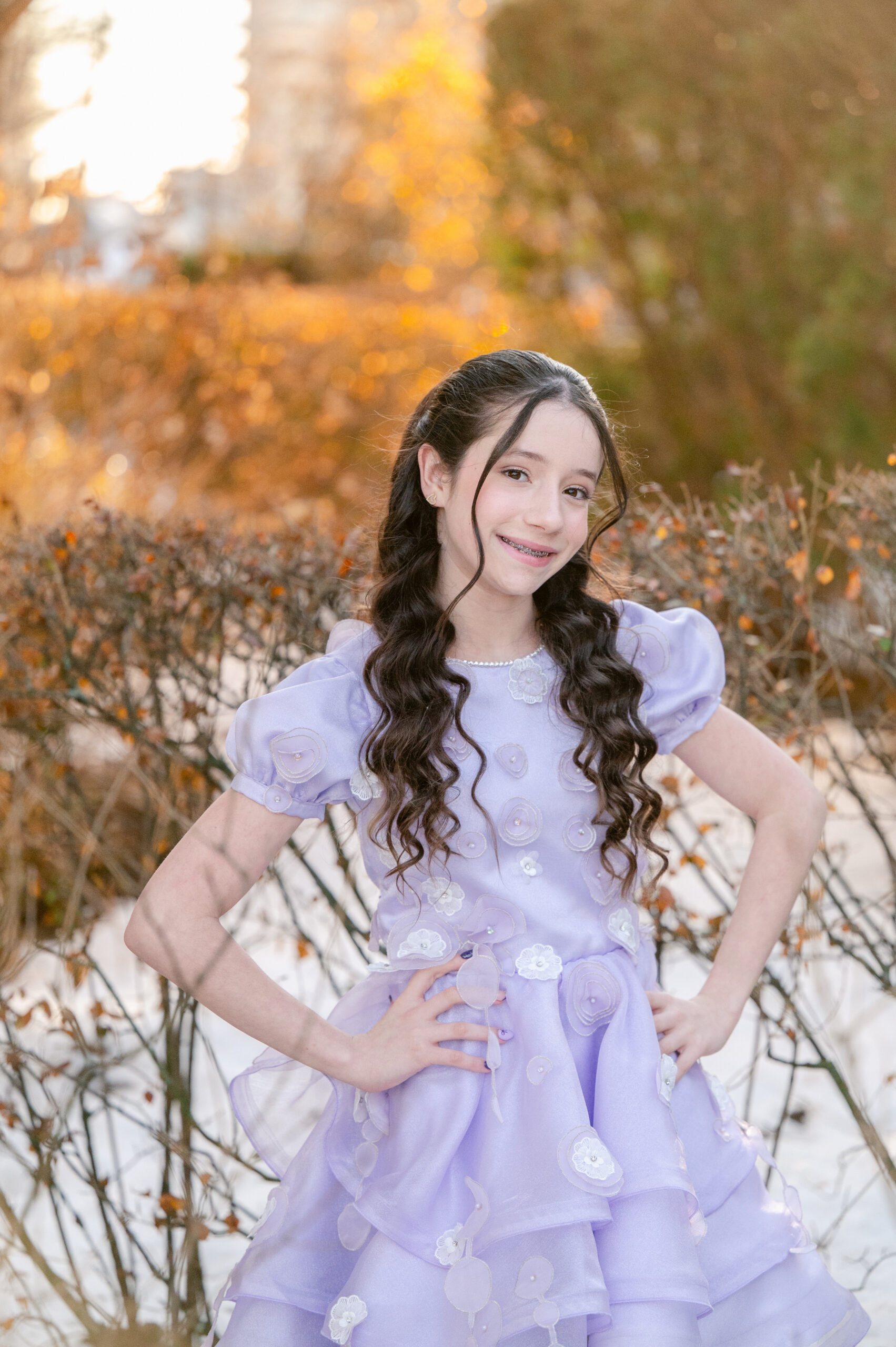 NYC Bat Mitzvah portrait of girl in purple dress with soft golden hour lighting